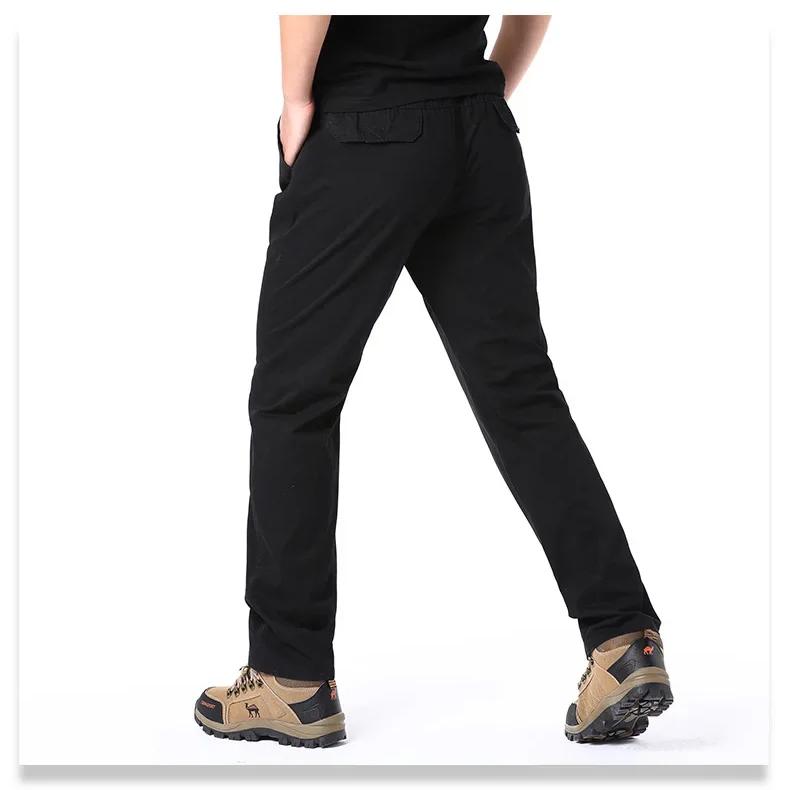 Wiosenne jesienne modne spodnie casualowe dla mężczyzn bawełniane spodnie cargo w jednolitym kolorze z elastyczną talią proste nogawki streetwear męskie spodnie joggers