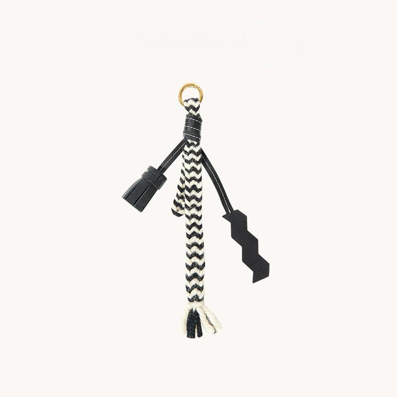 

Tiger Tooth Black Udo Weaving Ornament: Courage Stone Charm & Luck Transfer Retro Bag Accessory