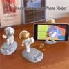 Astronaut Figurine Phone Holder: Creative Plastic Desktop Decor & Gift
