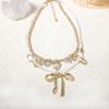 Fashion niche creative design sense double-layered alloy bow pendant necklace versatile temperament model