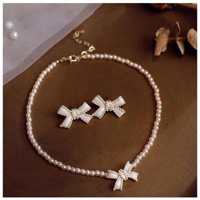 Children's Bowknot Pearl Necklace Set: Two-Piece White Jewelry with Exquisite Accessories