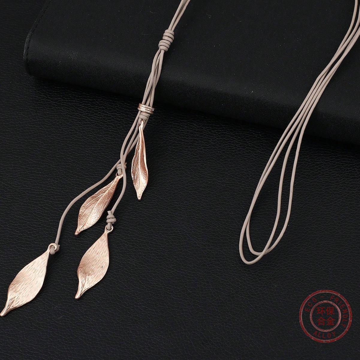 

New tassel leaf pendant, women s personalized leaf-shaped alloy cowhide rope versatile sweater chain