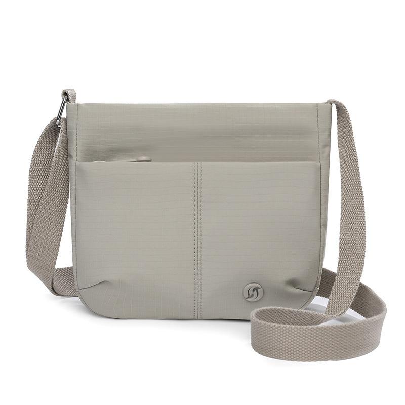 

Casual shoulder bag New candy color women s messenger bag Stylish and simple messenger bag Large capacity anti-splashing cloth bag сірий колір