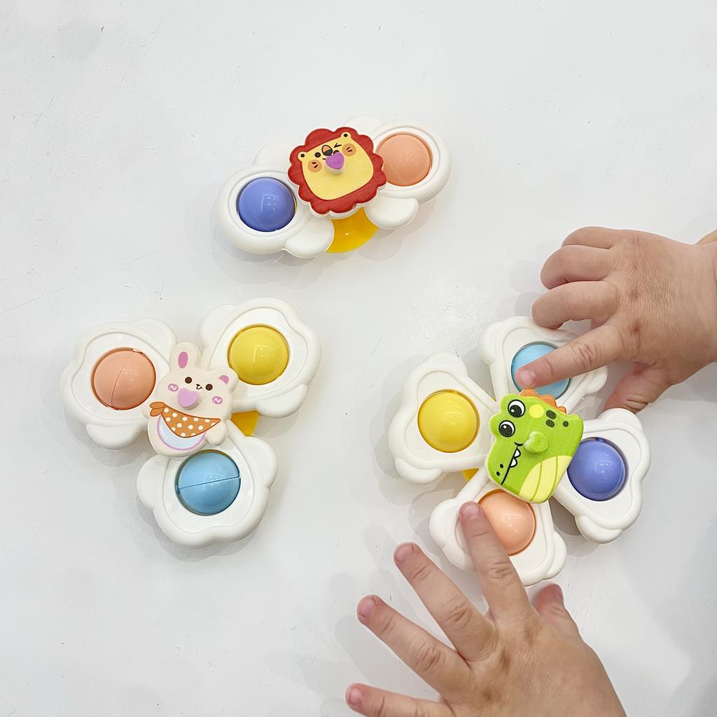 A Set of Three Cartoon Animal Suction Cup Spinning Tops for Babies, Designed To Enhance Hand-Eye Coordination During Early Education