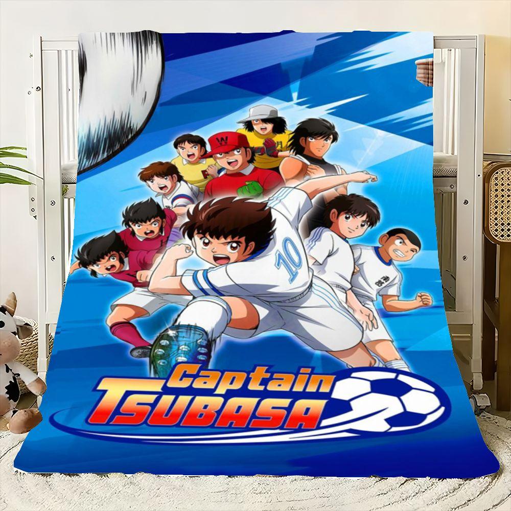 Dynamische Captain Tsubasa Fußball Anime Decke - Lebhaft blaue und weiße weiche Überwurfdecke mit ikonischen Charakteren in Aktion P