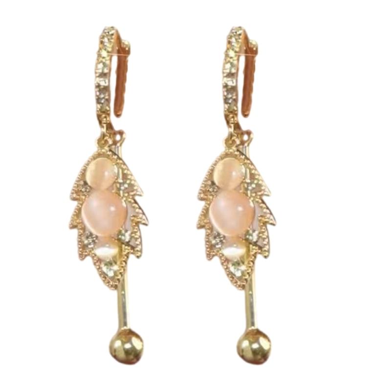 

Lightweight Brass Ear Cuff Intricate Leaf Pattern Embedded With Cats Eye Stone Simple Yet Elegant Jewelry Piece 1