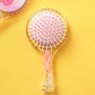 Hairbrush With Built-In Hair Tie