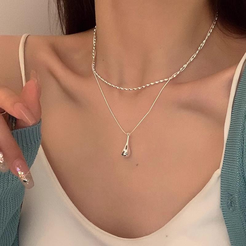 Elegant Double Layer Water Drop Necklace - Cold, Trendy, and Stylish Collarbone Chain for Women.