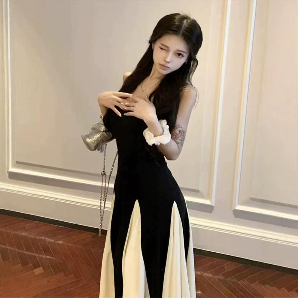 French high-end black and white splicing suspender dress Hepburn style beautiful unique temperament waist a word long dress summer