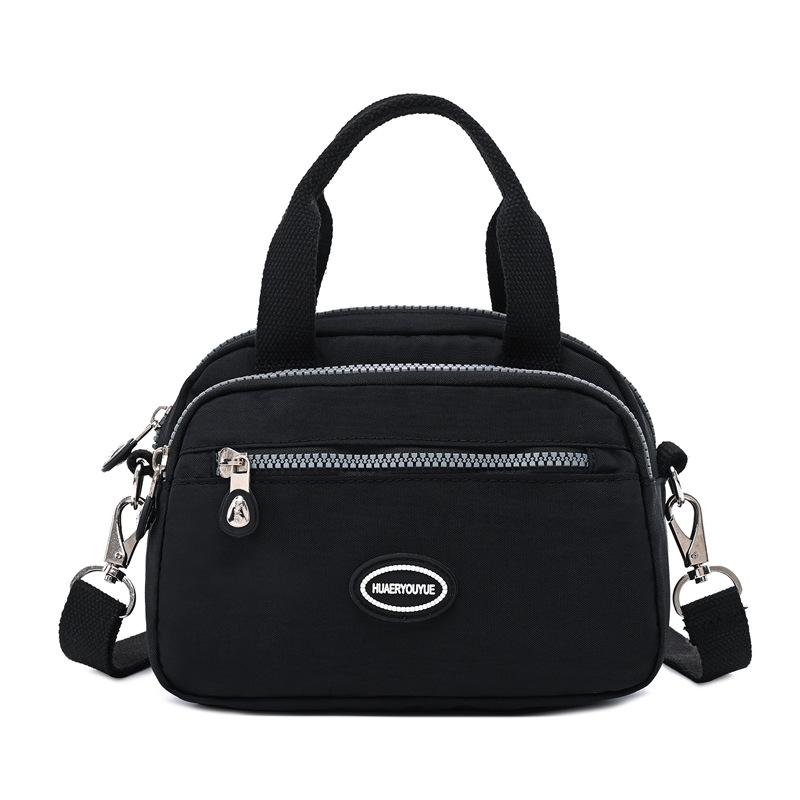 

2024 летняя новая женская сумка через границу, модная портативная сумка через плечо, легкая потертая нейлоновая повседневная сумка чёрный