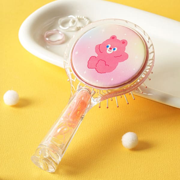 Hairbrush With Built-In Hair Tie