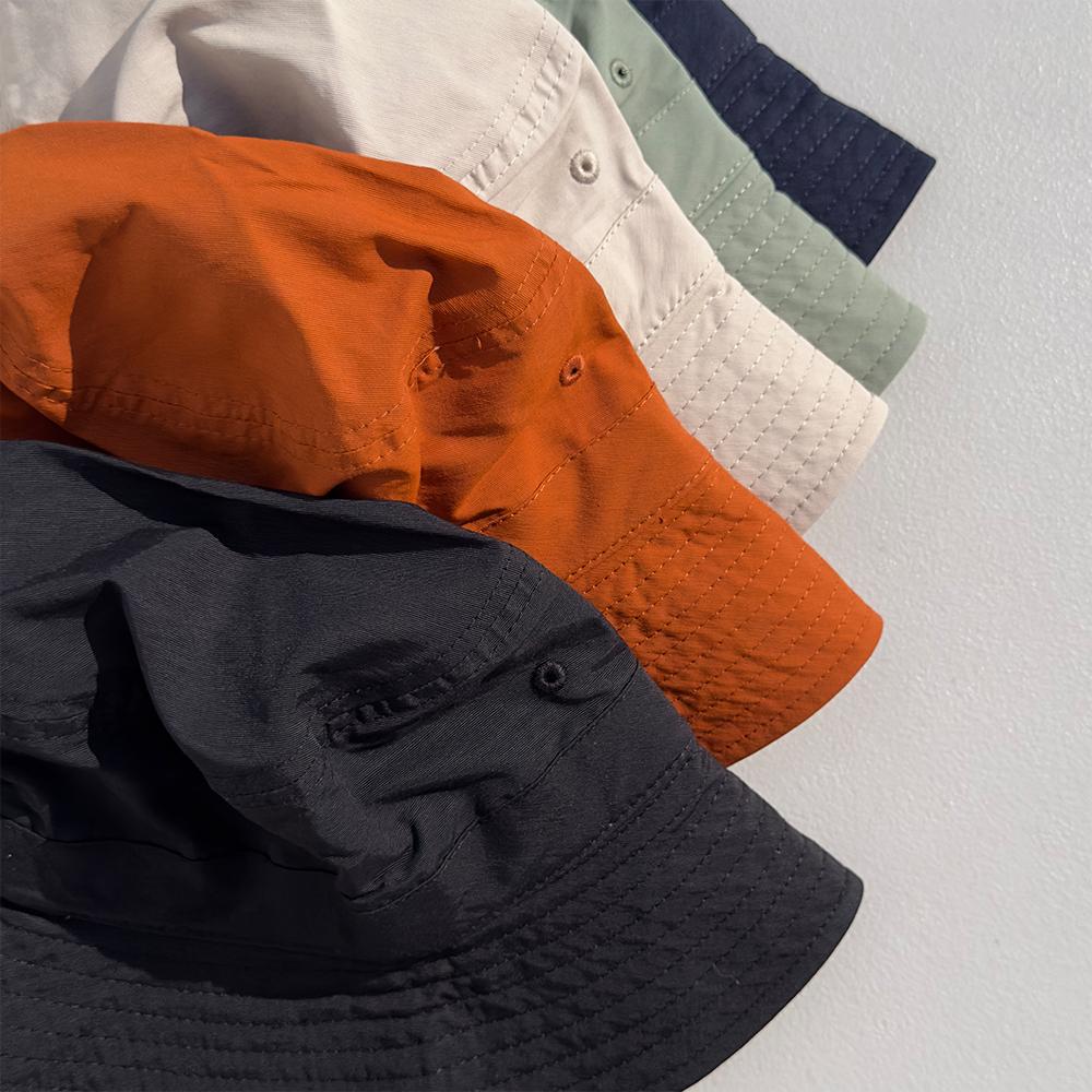Nyuhaeteun Baumwoll-/Nylon-Eimerhut (Orange)