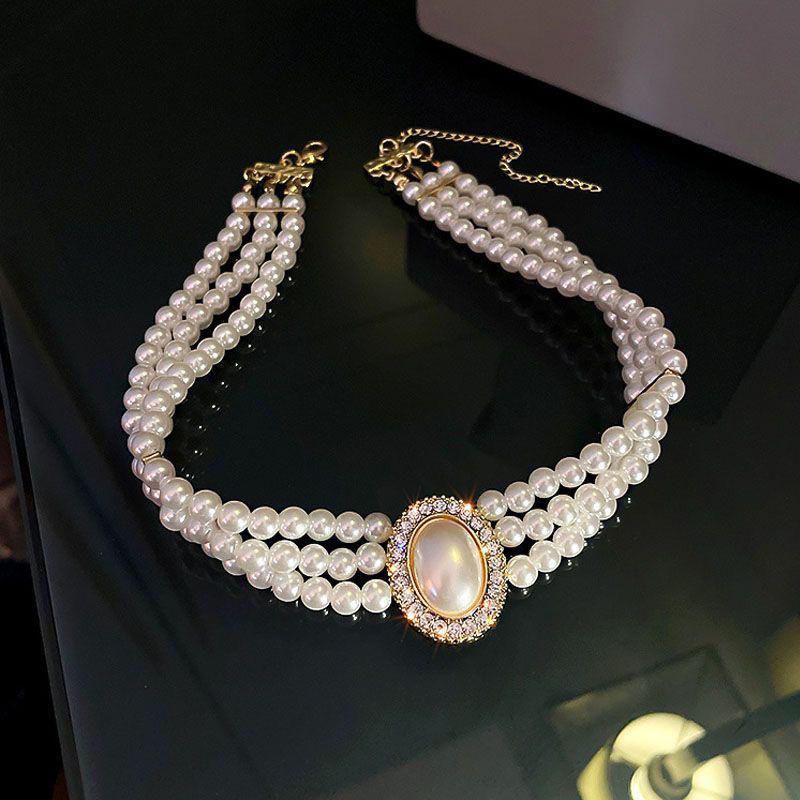 Women's Multi-Layer Pearl & Diamond Oval Necklace: Retro Hepburn Style, Light Luxury, Perfect for Sweaters and Dressy Outfits.