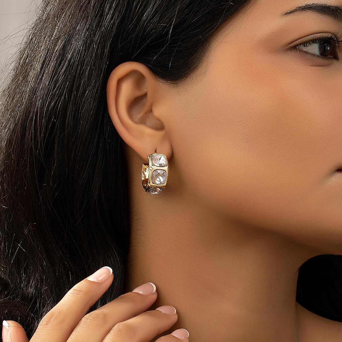 

Elegant Gold & Rhinestone Dangle Earrings - Advanced Fashion Statement