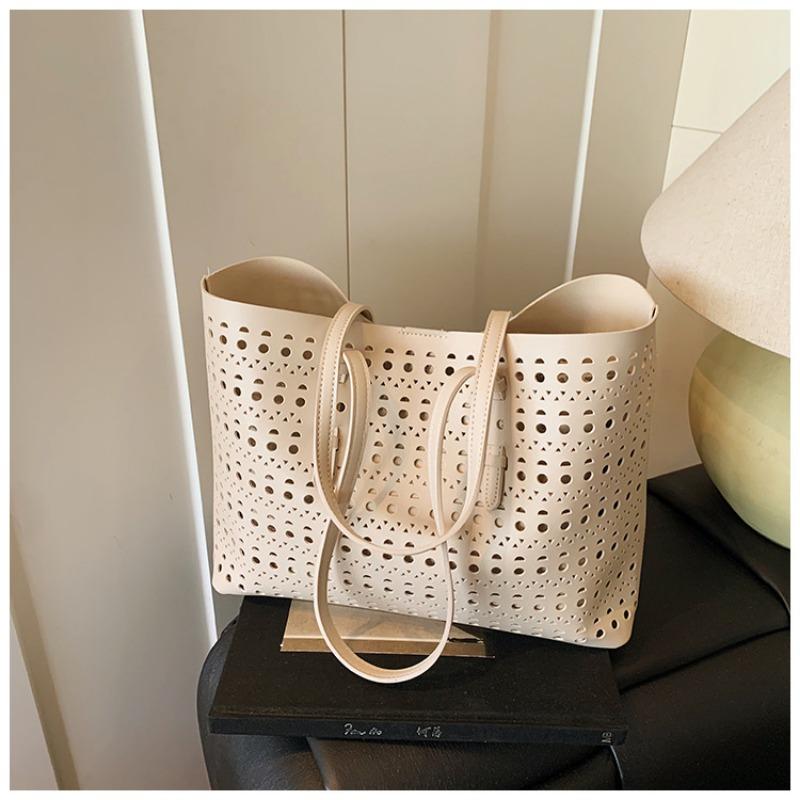 Large-capacity tote bag niche design simple hollow bag women's summer new versatile shoulder bag