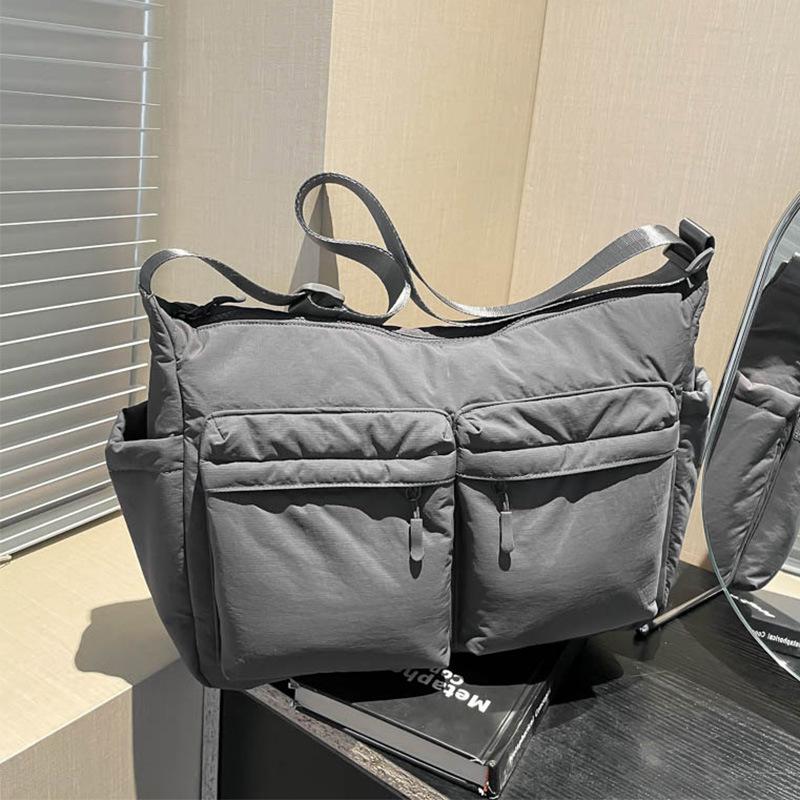 Unisex vodoodpudivá nylonová crossbody taška s více kapsami