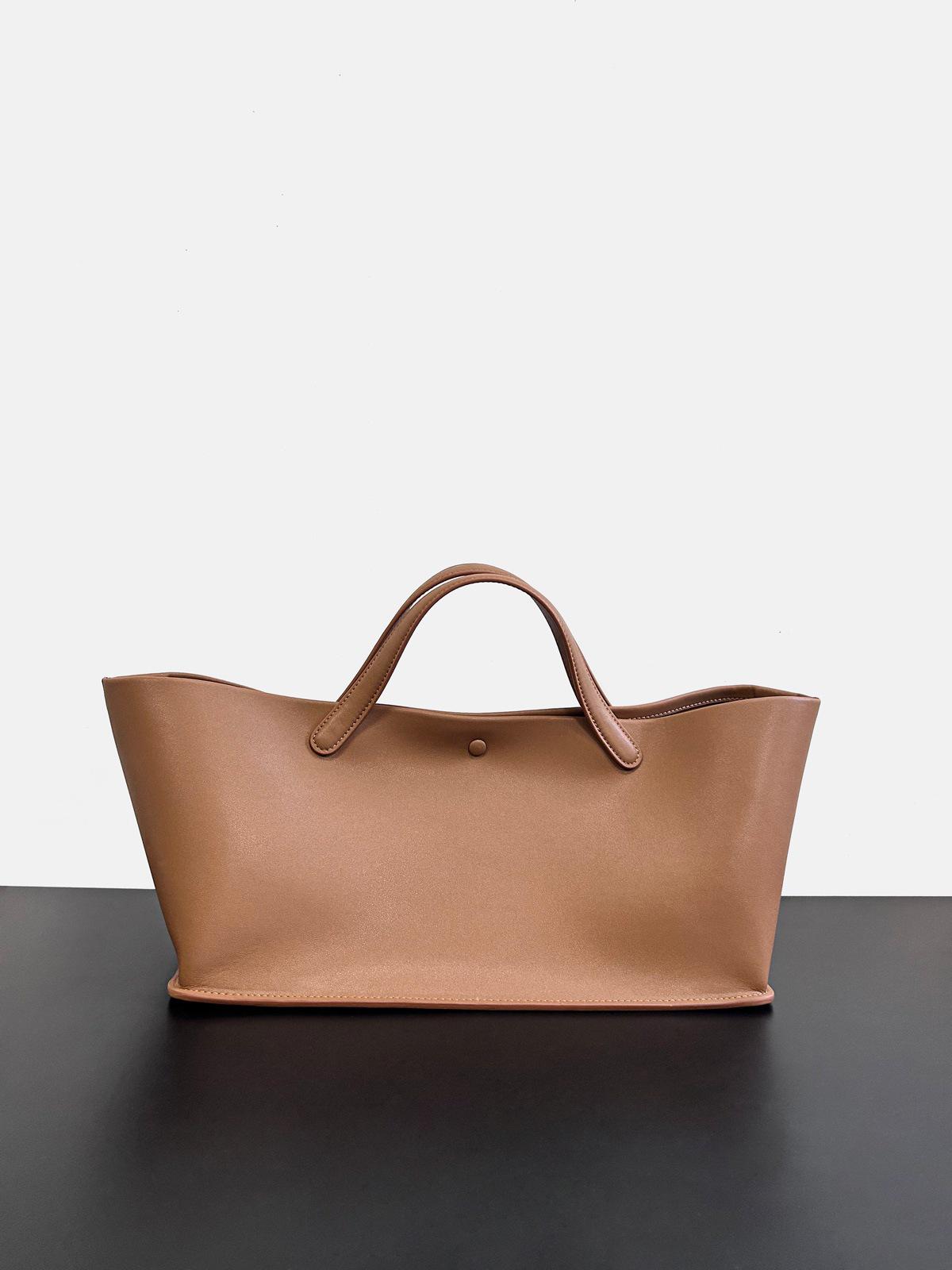 

The Row 2025 Женская сумка-тоут из премиальной кожи - Большая вместимость, сумка для поездок в стиле французского шика 36.5*20*18cm (No Logo)