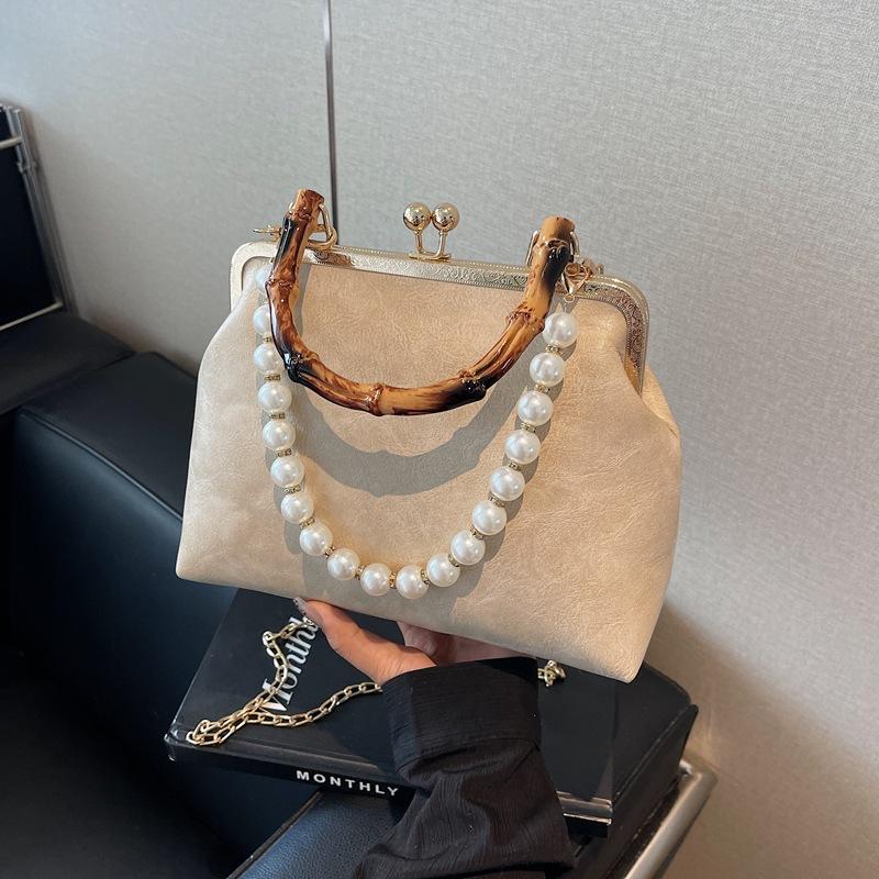Spring and summer retro small bag women's new fashion bamboo joint portable mouth gold bag pearl chain messenger bag