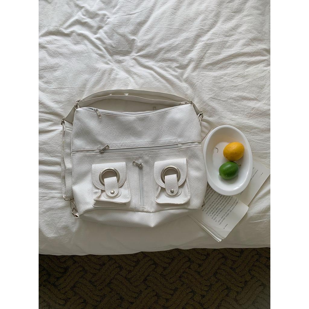 Koreanische Version Schlichte Persönlichkeit Vielseitig Modisch Reißverschlusstasche PU-Leder Tragetasche Schultertasche Pendeln Große Kapazität Rucksack