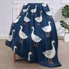 Cozy duck pattern flannel blanket, soft, warm and lightweight, navy blue background with white duck design, ideal for sofa bed,