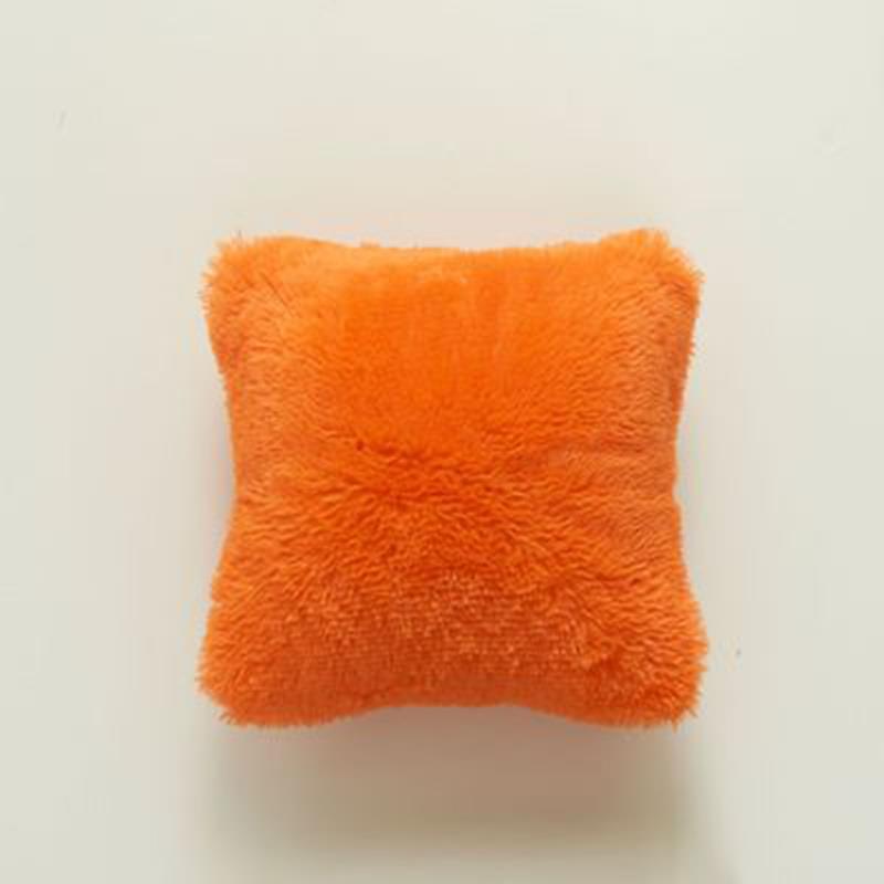 orange furry pillow