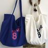 Spring and summer new printed canvas bag women's niche design large-capacity shoulder bag lazy atmosphere tote bag