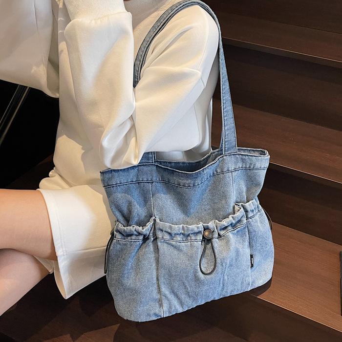 Große Denim-Canvas-Tragetasche Damen 2025 neue Sommer-Freizeit-Umhängetasche mit Falten College-Studenten-Klassentasche
