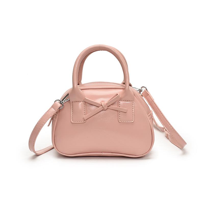 Südkoreas beliebte Nische einfache einfarbige tragbare Bowlingtasche Damen lässig ausländischer Stil hochwertige vielseitige Umhängetasche