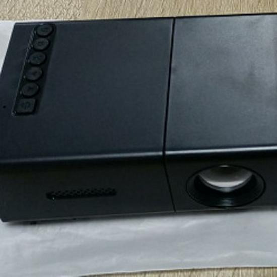 Best-Selling YG300 Yellow-White Mini Portable Projector with Mobile Screen Mirroring for Home Entertainment.