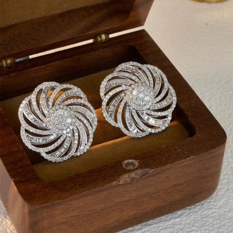 Exquisite durchbrochene Ohrringe mit Blumen für Frauen Silberfarben Brillante Zirkonia-Accessoires Wirbelform Ohrstecker Schmuck