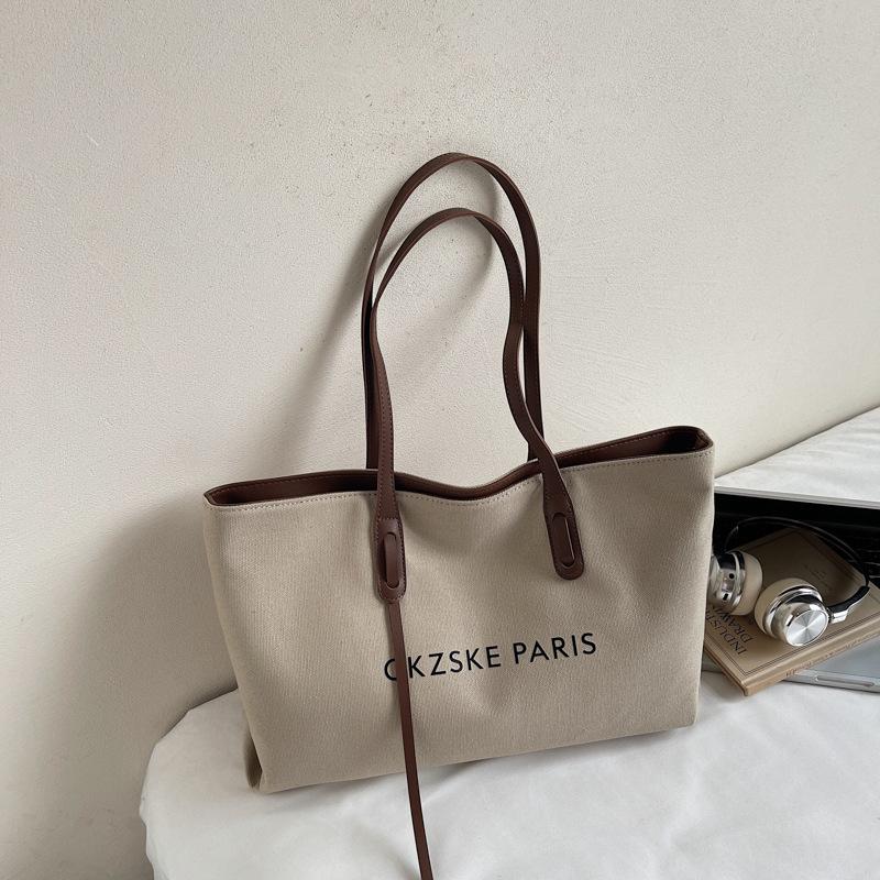

Casual large-capacity canvas bag women s 2025 new simple niche commuter tote bag college student class shoulder bag