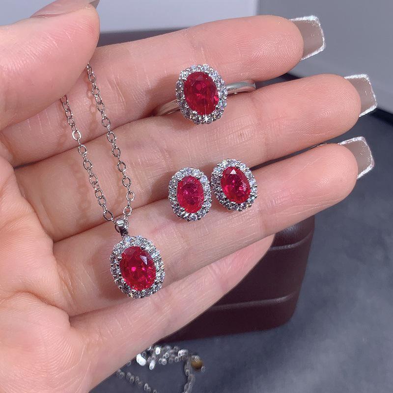 Elegant Skin-Brightening Red Corundum Jewelry Set: 1 Carat Pendant Necklace, Pigeon Blood Red Ring, and Earrings with Artificial Colored Gemstones.
