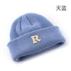 Women's Solid Color Letter Print R Rolled brim knitted hat for outdoor cycling, providing warmth, cold protection, and ear coverage