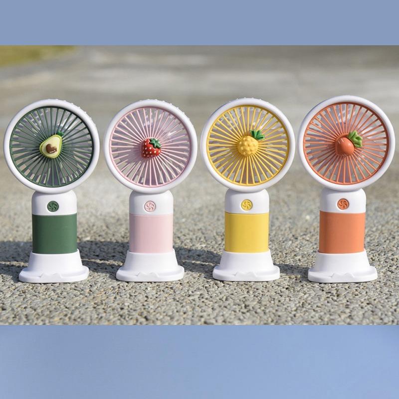 Portable Desktop Lazy Phone Stand with A Small Fan, Featuring Cute Cartoon-shaped Fruits and Flowers, for Charging Your Phone.