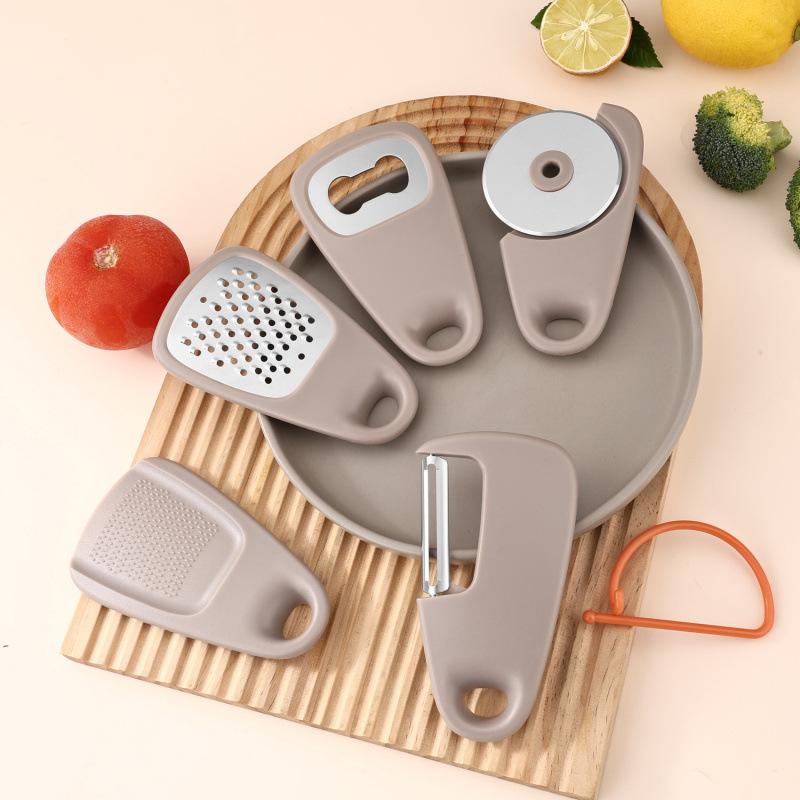 Multifunctional 5-in-1 Portable Kitchen Gadget Peeler Bottle Opener Garlic Grinder Cheese Grater
