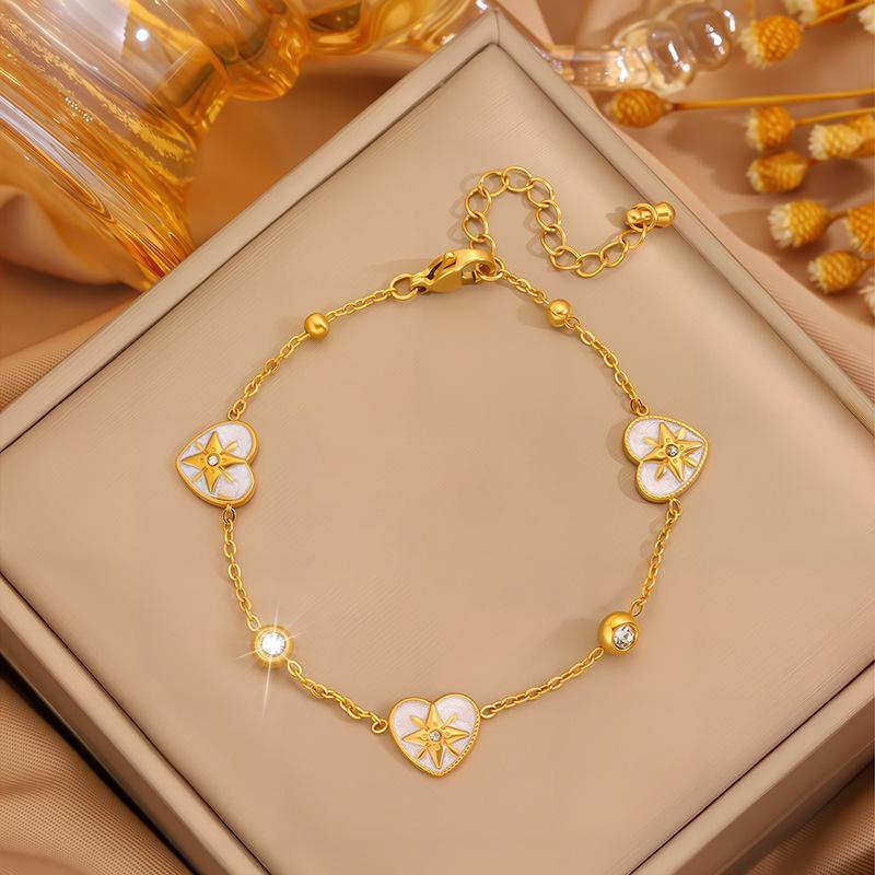 Elegant Women's Titanium Steel Bracelet with Diamond-Embedded Four-Leaf Clover and Eight-Pointed Star Design