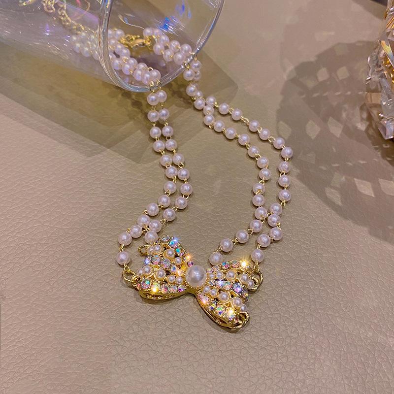 Pearl Neck Chain Trendy Short Bow Necklace Female Summer Light Luxury Fairy Gas Colored Diamond Collarbone Chain