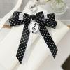Trendy Musical Note Keyring Key Holder Featuring Piano Keys And Delicate Bowknot Perfect For Music Enthusiasts