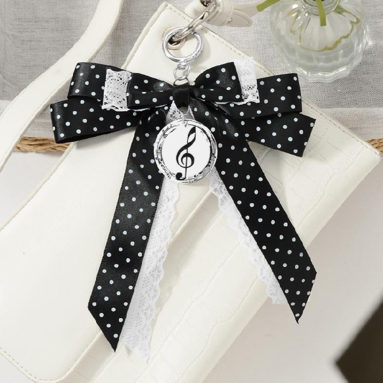 Trendy Musical Note Keyring Key Holder Featuring Piano Keys And Delicate Bowknot Perfect For Music Enthusiasts