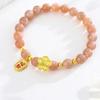 Gold-Plated Peach Blossom Bracelet with Pink Sunstone Pendant