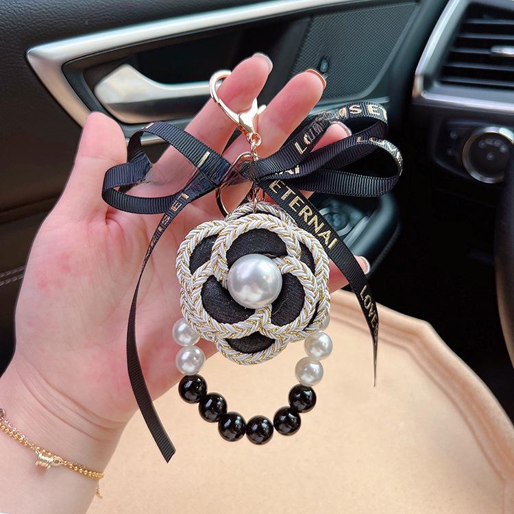 Elegant Black & White Pearl Camellia Keychain with Bow - Stylish Korean Flower Bag Charm