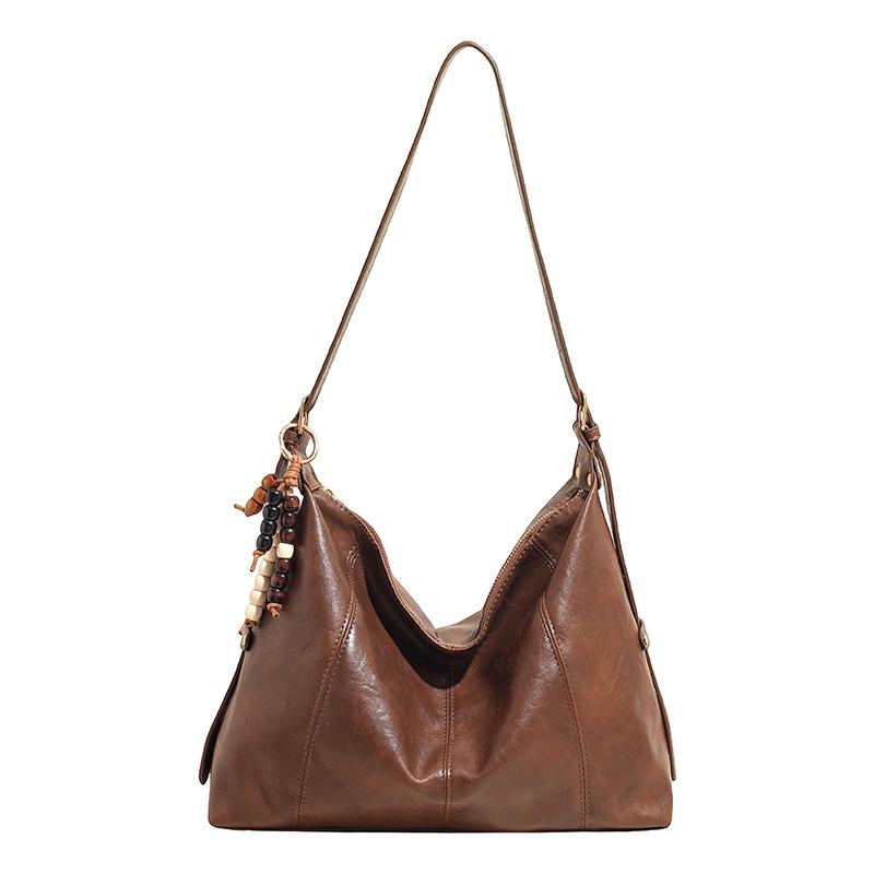 Эта сумка-тоут большой вместимости — универсальная и повседневная одноплечевая сумка-кроссбоди для поездок на работу.