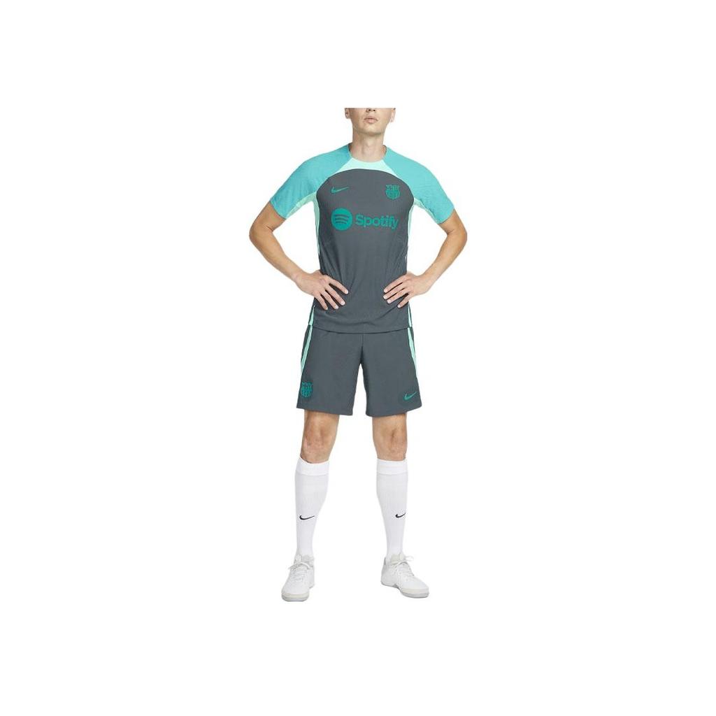 Nike FC. Barcelona Strike Elite Toppa Logo Vita Elastica Pantaloncini da Calcio Uomo Pantaloncini Verde Chiaro FD4142-437