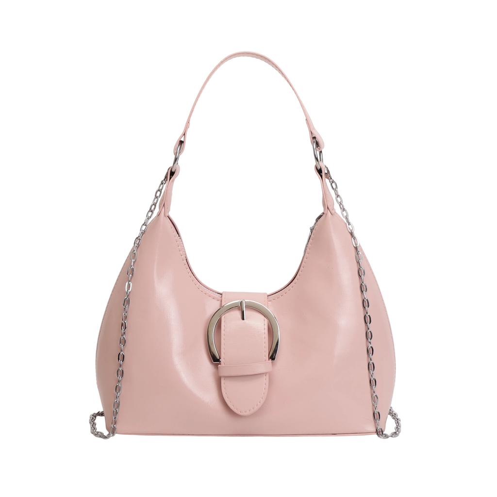 Solid color crescent-shaped hobo bag with metal D-ring embellishment, elegant underarm bag, versatile women's handbag for dates and everyday wear.