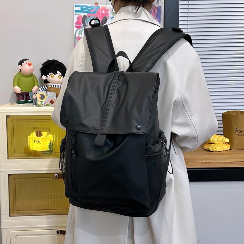 Schoolbag backpack women's new large-capacity solid color simple leisure college wind backpack trend flip student class schoolbag