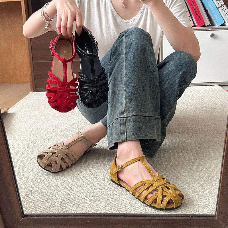 Woven flat-soled sandals women's summer retro outer wear hollowed-out baotou pig cage shoes one-button Roman shoes