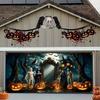 A Halloween garage door banner featuring terrifying bandages monsters witches bats pumpkins owls and dead trees