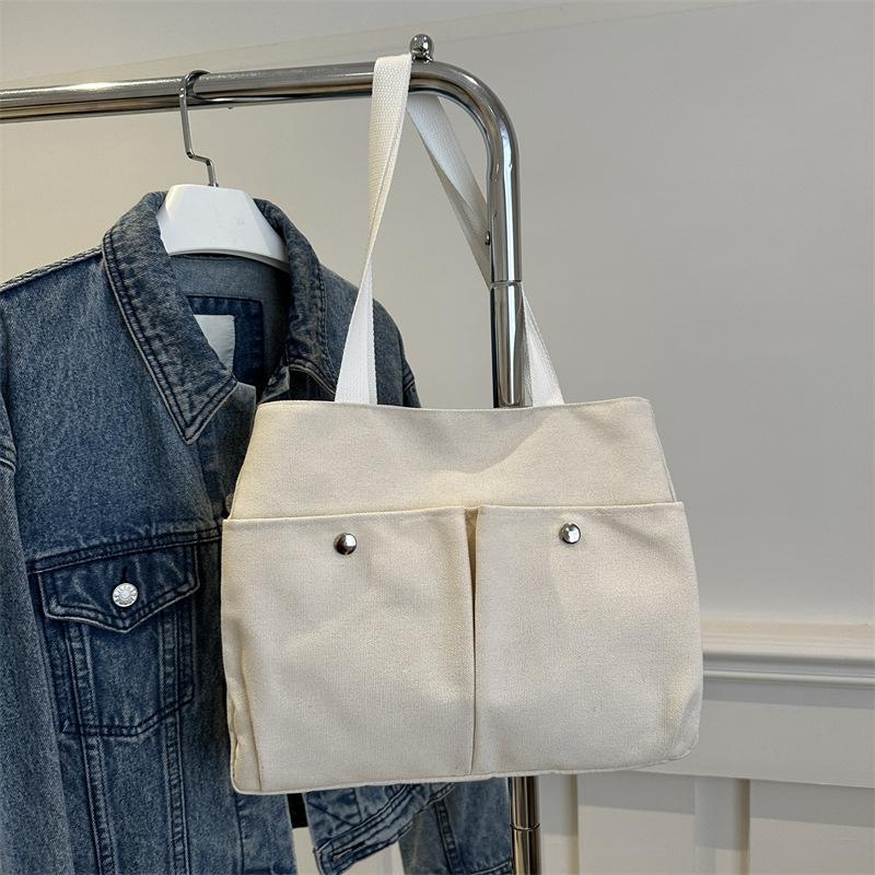

Canvas bag women s shoulder bag 2025 new trendy casual large-capacity commuting versatile student multi-pocket tote bag