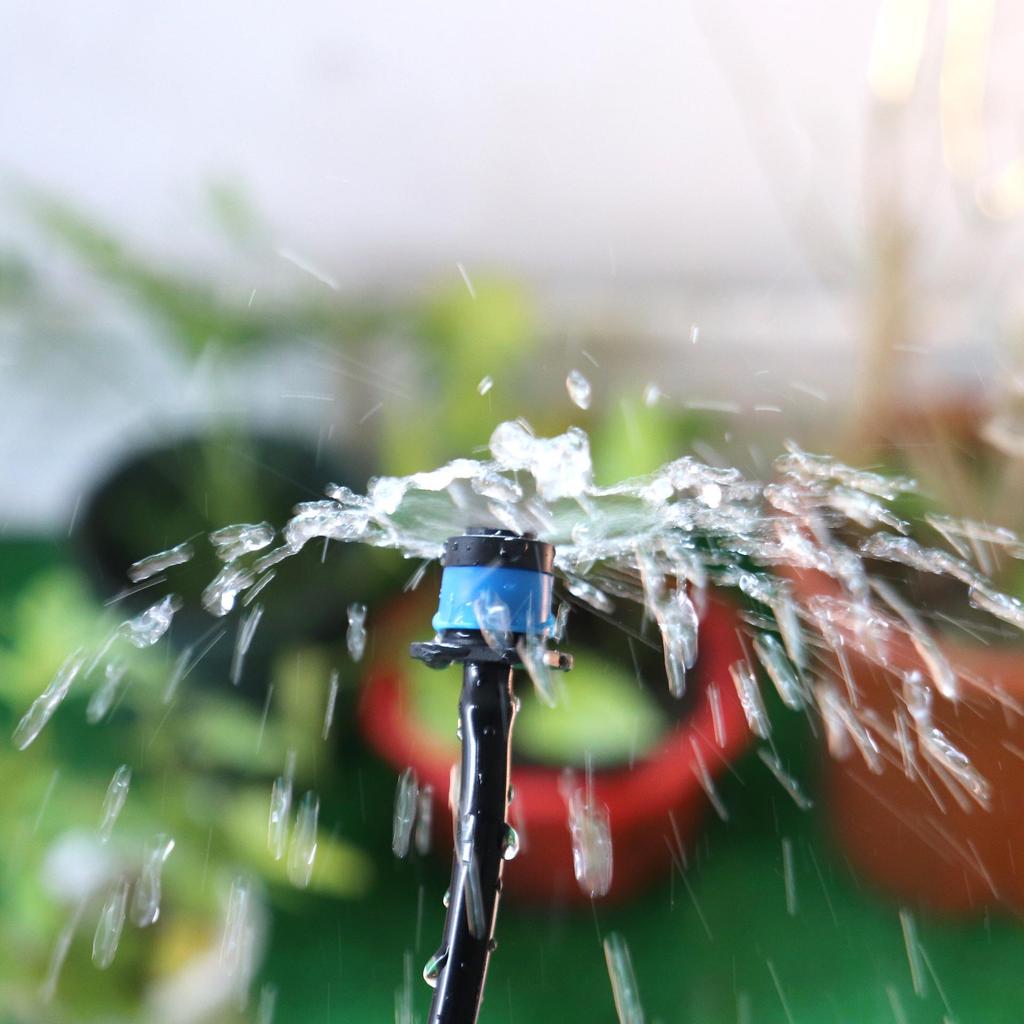 Adjustable Blue Umbrella-Shaped Drip Irrigation Sprinkler for Fruit Tree Watering Systems.