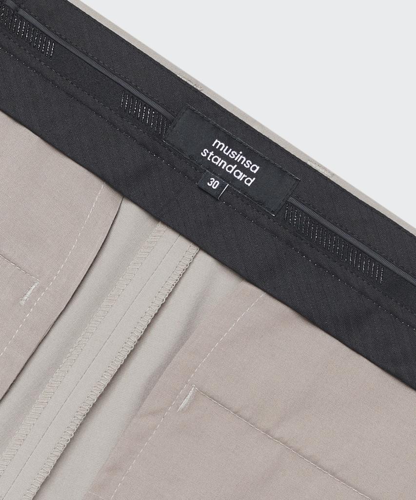 Musinsa Standard [Cooltandard] Tapered Hidden Banding Crop Slacks [Light Beige]